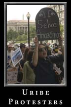 Demonstrators March  in protest of Colombian President Uribe's Luncheon at the National Press Club.